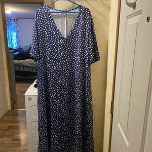 A blue long dress polkadot V-neck great for a night in the summer.
